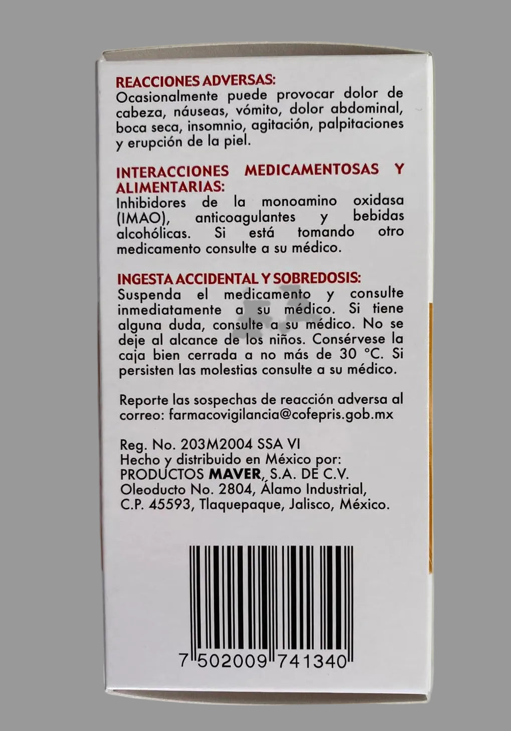 Back of a medication package with text and a barcode on a gray background