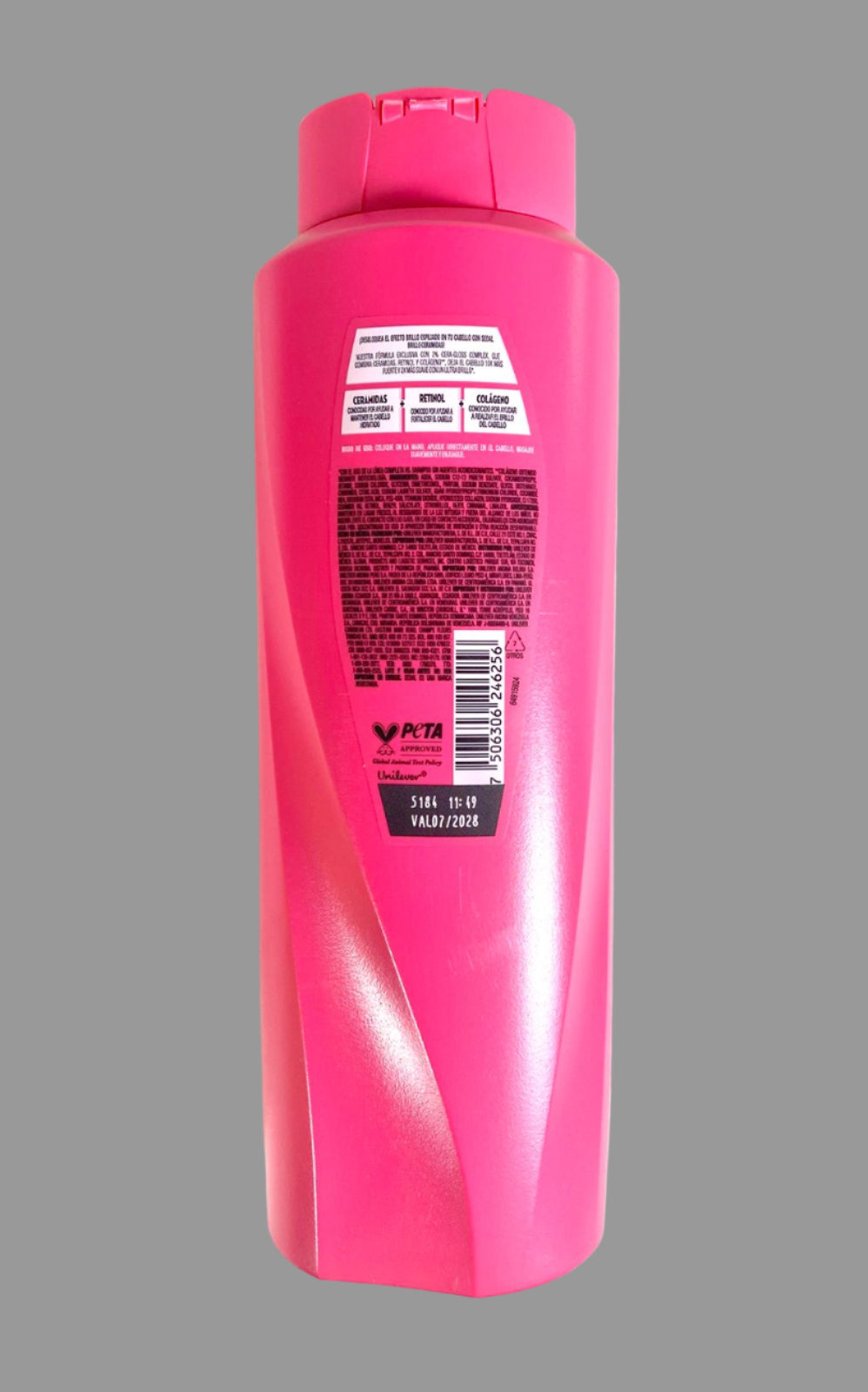 Pink shampoo bottle with label on a white background