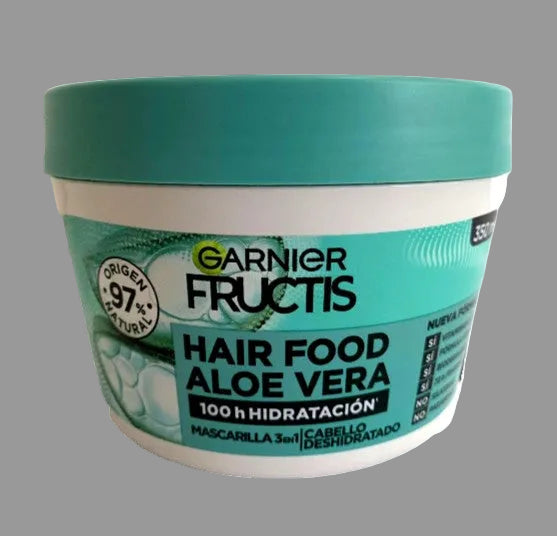 A 300ml white plastic jar of Garnier Fructis Hair Food Aloe Vera hair mask, featuring a teal-green lid and a matching teal-green label with white and black text.