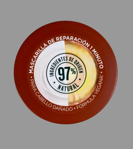 Cosmetic container with red lid and white body on a white background