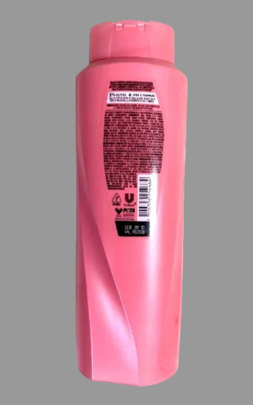 Pink shampoo bottle with label on a white background
