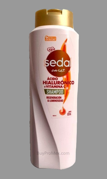 A bottle of SEDA Care Plus Hyaluronic Acid, Vitamin C Shampoo with a pink label and gold accents, containing 620ml/21oz of product.