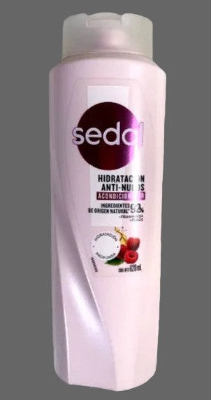 Sedal shampoo bottle with visible branding on a gray background