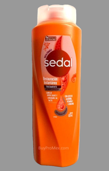 A bottle of Sedal Restauracion Instantanea conditioner in orange packaging.