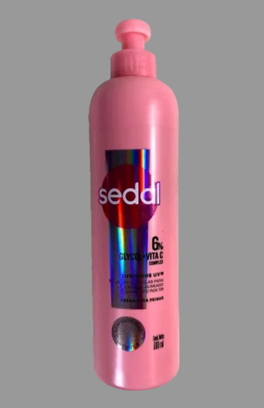 Pink bottle with a pump dispenser labeled 'sedal' on a white background